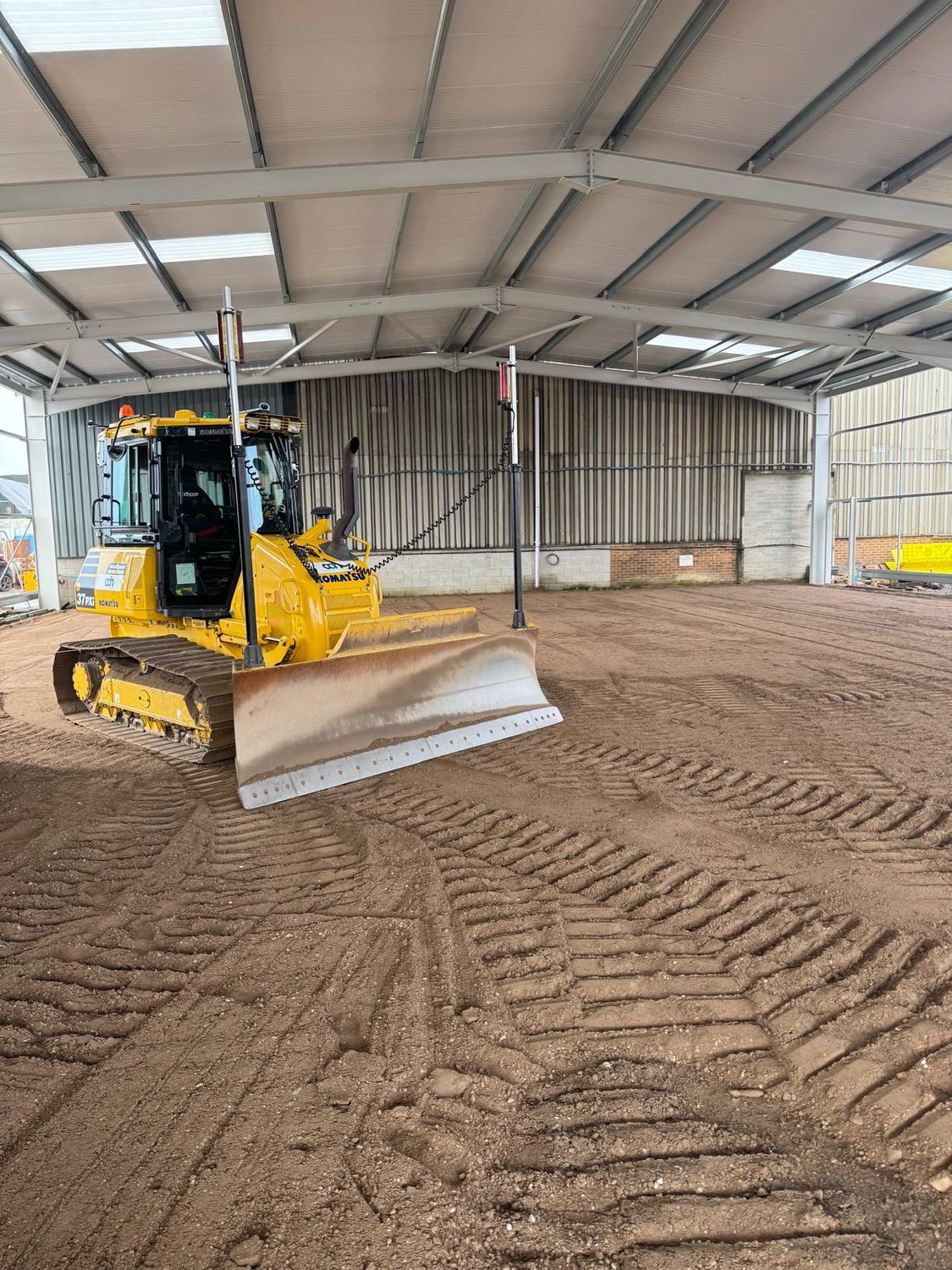 Laser controlled dozer levelling a floor sub-base