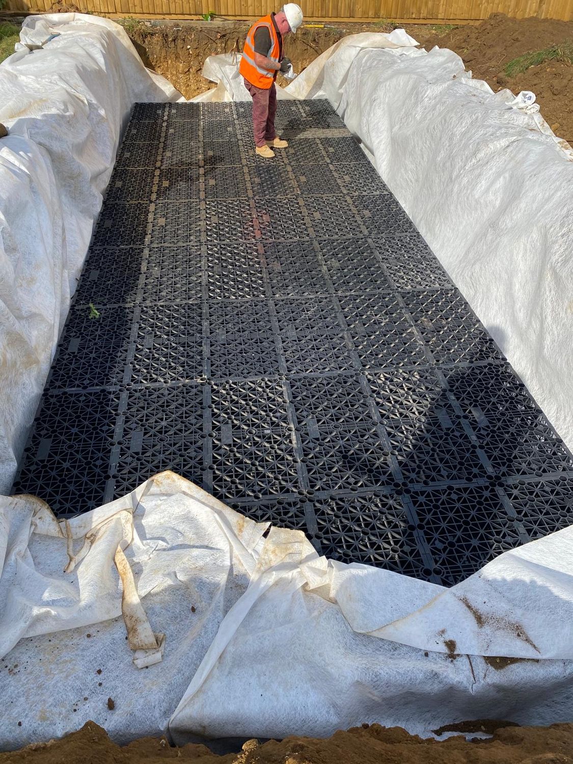 Attenuation crates installed in a lined excavation