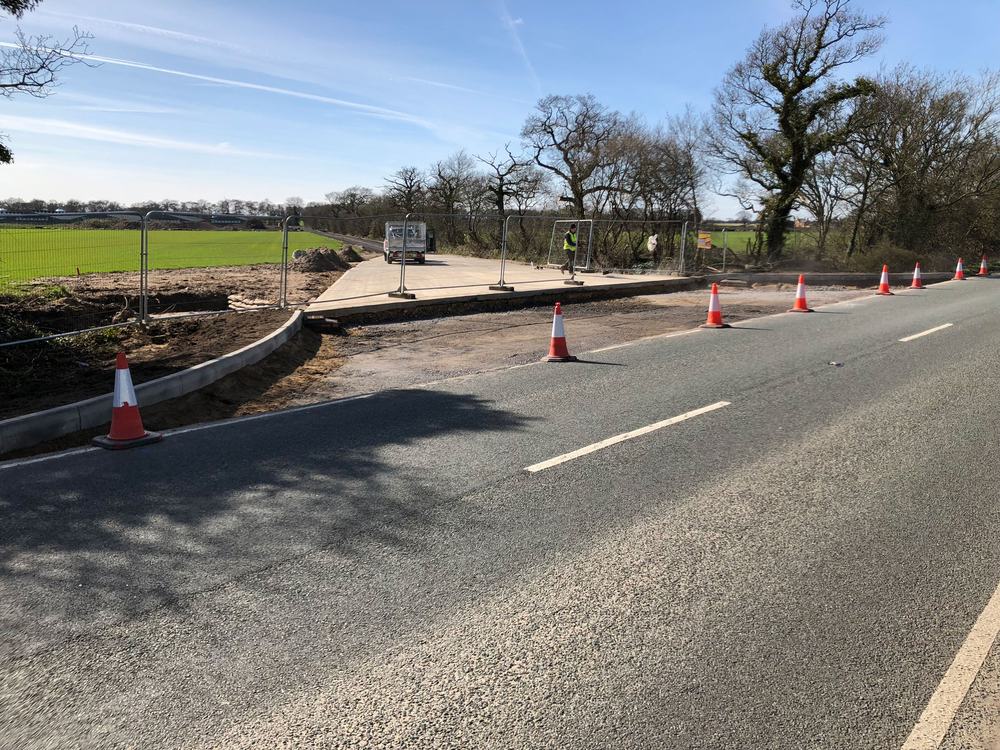 New site entrance with kerbing beside a road