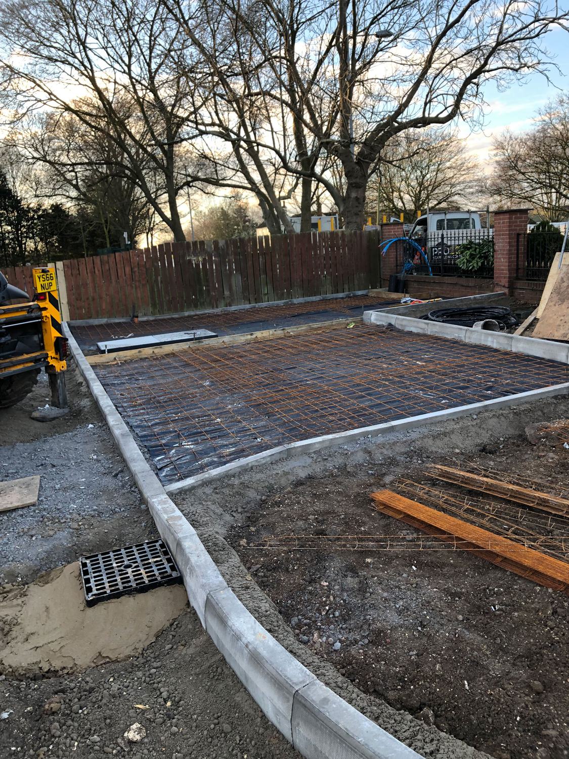 Reinforced slab with kerb edging and drainage